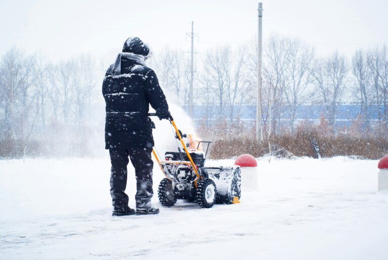 Home 2 A man cleans snow